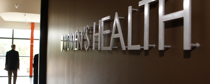 Womens health sign across the wall