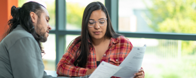 Two people getting help with health insurance