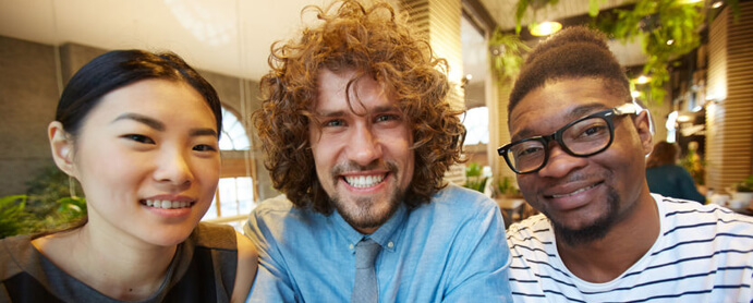 Men smiling into camera